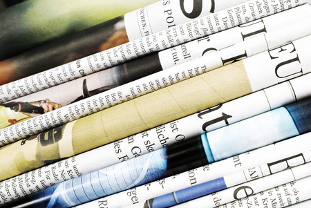 Close-up of folded newspapersの写真素材