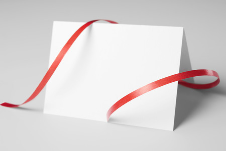 Blank thank you or greeting card with red ribbonの写真素材
