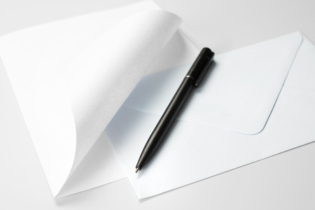 Correspondence Set: Blank Sheet of Paper with Curled Corner, Envelope and Black Pen