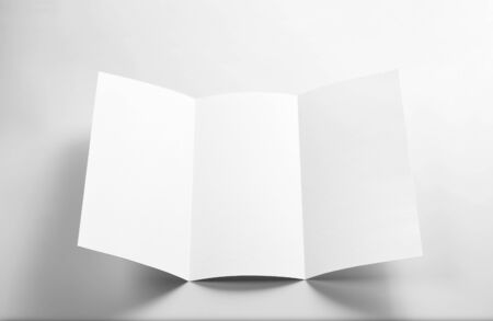 Blank Open Flyer Over Grey Backgroundの写真素材