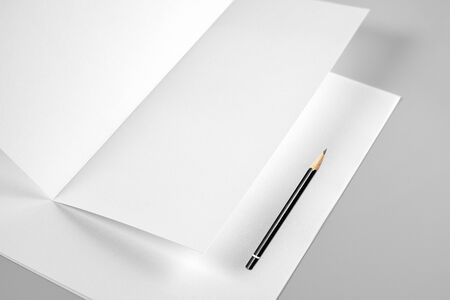 Blank Folded Sheet of Paper or Letterhead and Pencilの写真素材