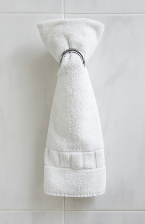 One folded white bath towel in modern bathroomの写真素材
