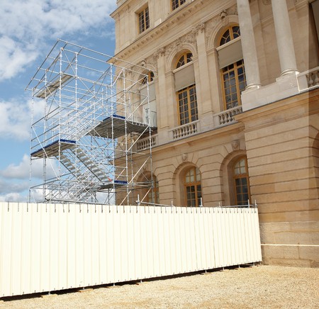 Versailles plaza in scaffolds on sky background の写真素材