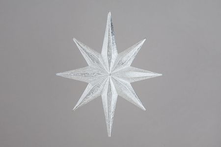 Christmas decoration silver star on gray backgroundの写真素材