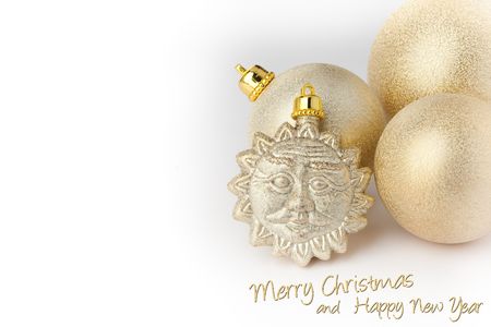 Christmas decoration gold balls and sun on whiteの写真素材