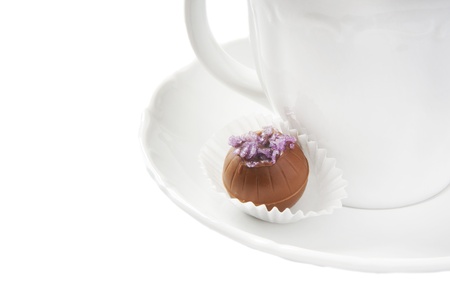 Delicious chocolates praline on white saucerの写真素材