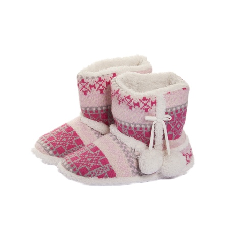 Home knitted ugg boots with fur inside on whiteの写真素材