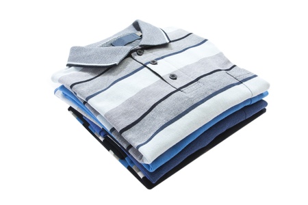 Pile of man polo shirts on whiteの写真素材