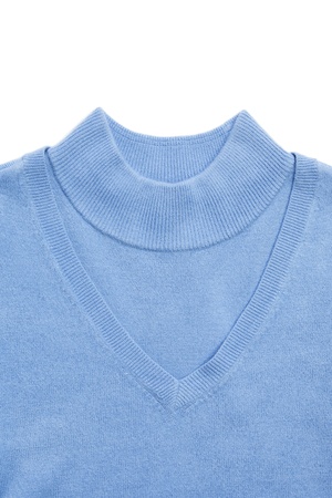 Part of blue woman knitted blouses set on whiteの写真素材