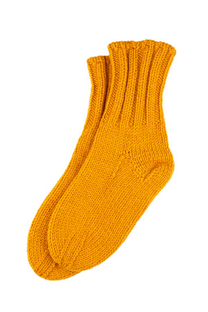 Yellow wool socks isolated on whiteの写真素材