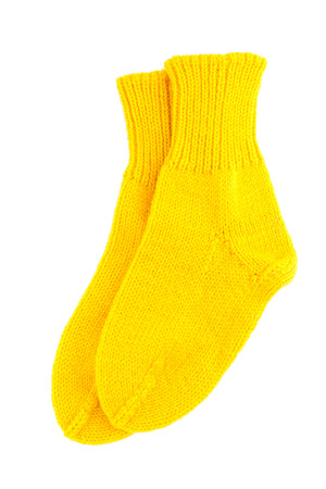 Yellow wool socks isolated on white