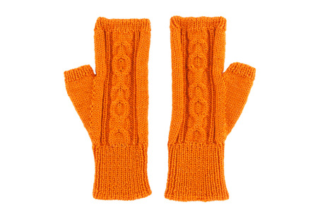 Orange wool gloves on white isolatedの写真素材