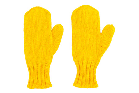 Yellow wool mittens on white isolatedの写真素材