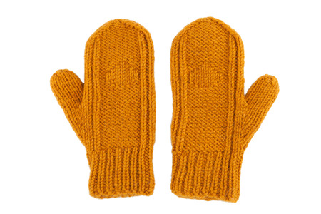 Yellow wool mittens on white isolatedの写真素材