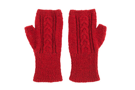 Red wool mittens on white isolatedの写真素材