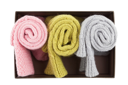 Folded wool socks in box on whiteの写真素材