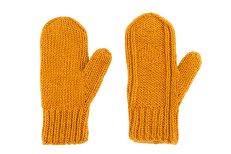 Yellow wool mittens on white isolatedの写真素材