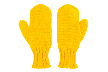 Yellow wool mittens on white isolatedの写真素材
