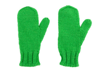Green wool mittens on white isolatedの写真素材