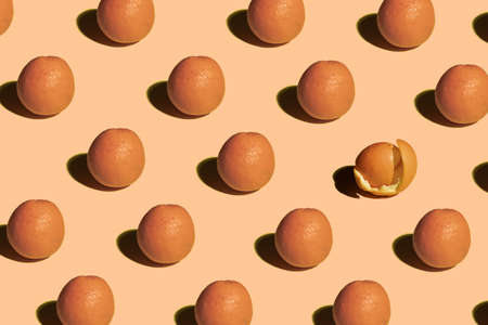 Oranges standing on pastel background pattern minimalの写真素材