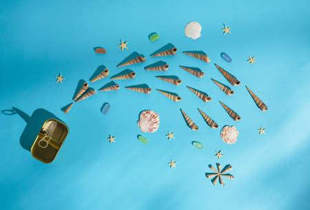 Tin can, seashels, starfishes  and colorful glass stones lay down on bottom of the sea. Minimal...