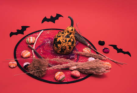 Pumpkin, little fabric pumpkinks and fabric bats standing on witchÂ´s hat. Funny Halloween minimal...
