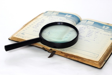 Magnifying glass and notebookのeditorial素材
