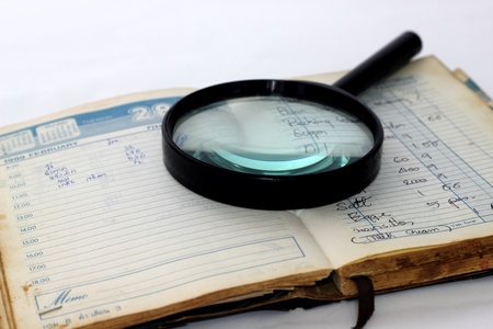 Magnifying glass and notebookのeditorial素材
