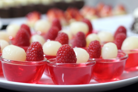 a raspberry jelly Garnish with fresh berriesの写真素材