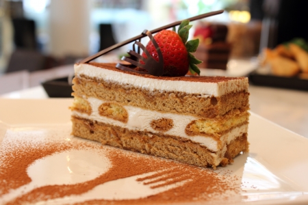 Tiramisu decorated with fresh fruit and  chocolate