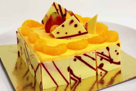 A Orange cake on a white backgroundの写真素材