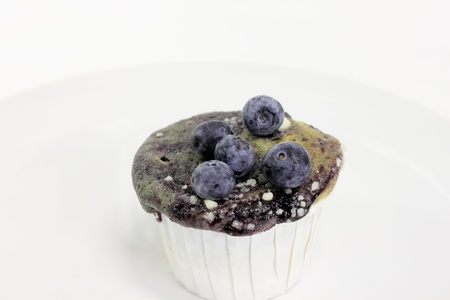 Blue berry muffin on a white backgroundの写真素材