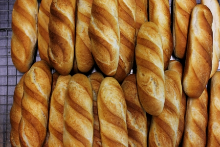 A French bread sticks on a painted tableの写真素材