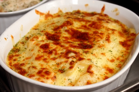 A Fresh lasagna in a white container の写真素材