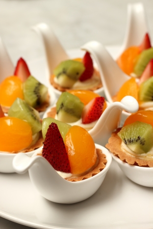 A delicious fruit tart witth peach and strawberriesの写真素材