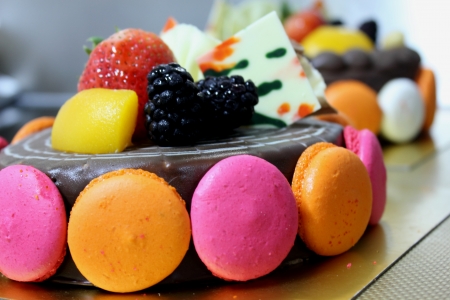 Dark chocolate cake with macaroon and fruitの写真素材