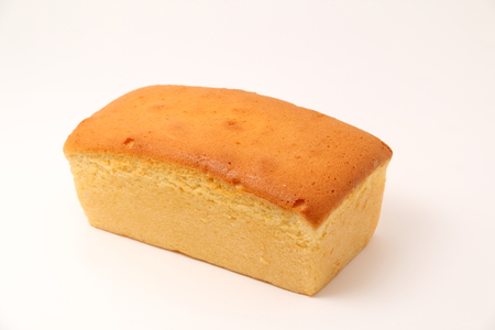A butter cake on a white background.の写真素材