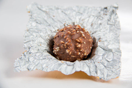 Almond chocolate ball isolated on white background