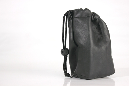 Black  bag packaging isolated over white backgroundの写真素材