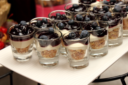 Blueberry cream in glass  closeup on tableの写真素材