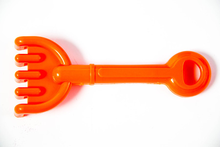 bright colourful plastic beach toys on white backgroundの写真素材