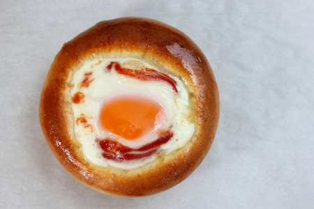 Single bun stuffed with the baked egg.の写真素材
