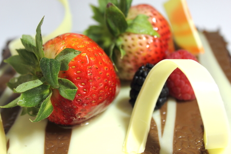 A Dark chocolate cake with sour strawberry.の写真素材