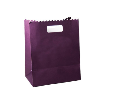 A  purple color paper bags isolated on white.の写真素材