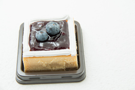 A Blueberry Cream Cheese cake on white