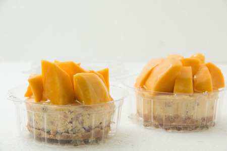 Cheese cake with mango in a cupの写真素材