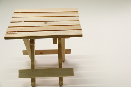 A Wooden folding stool  on white background.の写真素材