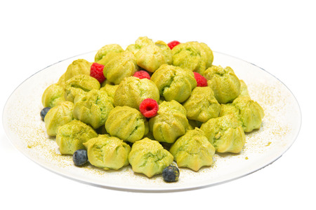 A Fresh green tea eclairs on white.
