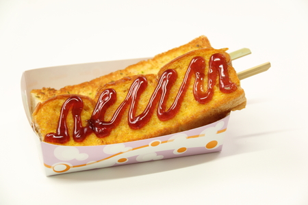Bread with strawberry jam in box on white background.の写真素材