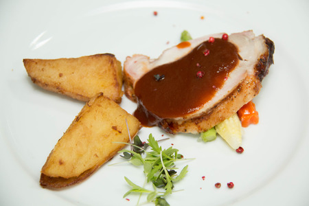 A closeup view of a delicious grilled pork steak.の写真素材